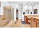 Well-lit bathroom features a bathtub, shower, dual sinks, and vanity area at 13965 N 135Th Dr, Surprise, AZ 85379