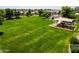 Expansive green community park with a covered playground, offering a serene and playful outdoor space at 13965 N 135Th Dr, Surprise, AZ 85379