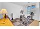 Home gym featuring an elliptical machine, weight equipment, and a window for natural light at 13965 N 135Th Dr, Surprise, AZ 85379