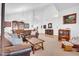 Large living room with vaulted ceilings and carpet flooring at 13965 N 135Th Dr, Surprise, AZ 85379