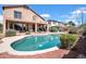Enjoy the backyard pool and adjacent covered patio of this beautiful two-story home at 13965 N 135Th Dr, Surprise, AZ 85379