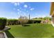 Spacious backyard with artificial turf and well-maintained landscaping provides a relaxing outdoor space at 16540 E El Lago Blvd # 2, Fountain Hills, AZ 85268