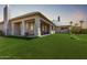 Backyard features a covered patio, artificial turf, and a fence for added privacy at 16540 E El Lago Blvd # 2, Fountain Hills, AZ 85268