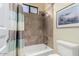 Bright bathroom featuring a shower-tub combo, neutral tile, and art on the wall at 16540 E El Lago Blvd # 2, Fountain Hills, AZ 85268