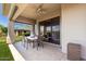 Covered patio features tile flooring, ceiling fan, and access to the lush backyard at 16540 E El Lago Blvd # 2, Fountain Hills, AZ 85268