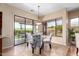 Elegant dining area with modern table and chairs, sliding glass doors to patio at 16540 E El Lago Blvd # 2, Fountain Hills, AZ 85268