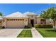 Inviting single-story home showcasing a two-car garage, manicured lawn, and tidy landscaping at 16540 E El Lago Blvd # 2, Fountain Hills, AZ 85268