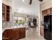 An open concept kitchen with wood cabinets flows into a dining area and living room at 16540 E El Lago Blvd # 2, Fountain Hills, AZ 85268