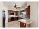 Well-equipped kitchen with granite countertops, dark wood cabinetry, and modern appliances at 16540 E El Lago Blvd # 2, Fountain Hills, AZ 85268