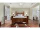 A spacious main bedroom with hardwood floors and views into the living area and bathroom at 16540 E El Lago Blvd # 2, Fountain Hills, AZ 85268