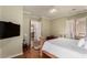 A spacious main bedroom with hardwood floors and views into the living area and bathroom at 16540 E El Lago Blvd # 2, Fountain Hills, AZ 85268