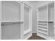 This walk-in closet with built-in shelving offers ample storage and organizational options at 17429 W Red Bird Rd, Surprise, AZ 85387