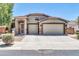 Inviting single-story home with a two-car garage and low-maintenance landscaping at 17429 W Red Bird Rd, Surprise, AZ 85387