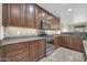 Beautiful kitchen featuring stainless steel appliances, granite countertops, and ample storage at 17429 W Red Bird Rd, Surprise, AZ 85387
