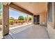 Covered outdoor living space with concrete patio, view of the landscaped backyard at 17429 W Red Bird Rd, Surprise, AZ 85387