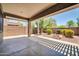 Covered patio area with concrete flooring offering views of the landscaped backyard at 17429 W Red Bird Rd, Surprise, AZ 85387