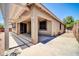 Back patio with a covered pergola, concrete floors, and sliding glass door access to the home's interior at 17429 W Red Bird Rd, Surprise, AZ 85387