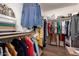 Spacious walk-in closet with ample hanging space and built-in shelving for organized storage at 18415 W Surprise Farms N Loop, Surprise, AZ 85388