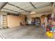 Spacious garage with ample storage cabinets and plenty of room for parking and projects at 18415 W Surprise Farms N Loop, Surprise, AZ 85388