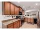 Charming kitchen with wood cabinets, modern appliances, and an efficient design for easy cooking at 18415 W Surprise Farms N Loop, Surprise, AZ 85388