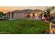 Spacious backyard featuring an outdoor kitchen, lush lawn, and serene ambiance, perfect for recreation and relaxation at 2111 E Azalea Dr, Chandler, AZ 85286