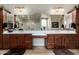 Bathroom with dual sinks, dark wood cabinets, and ample counter space at 2111 E Azalea Dr, Chandler, AZ 85286