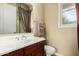 Well-lit bathroom featuring a vanity with dual sinks, a toilet, and ample counter space at 2111 E Azalea Dr, Chandler, AZ 85286