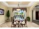 Cozy dining area with sliding glass doors leading to outdoor patio and lush backyard at 2111 E Azalea Dr, Chandler, AZ 85286