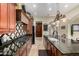 Spacious kitchen boasts granite countertops, custom cabinetry, and modern appliances, ideal for culinary enthusiasts at 2111 E Azalea Dr, Chandler, AZ 85286