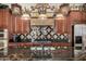 Detailed kitchen island featuring dark countertops and ornate fixtures, creating an elegant and functional cooking space at 2111 E Azalea Dr, Chandler, AZ 85286