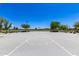 Full-sized basketball court with multiple hoops, benches, and well-maintained landscaping at 22495 E Silver Creek Ln, Queen Creek, AZ 85142