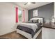 Cozy bedroom offers a calm color scheme, natural light, carpet floors, and a ceiling fan at 22495 E Silver Creek Ln, Queen Creek, AZ 85142