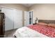 Comfortable bedroom with a sliding closet door and ensuite bathroom at 22495 E Silver Creek Ln, Queen Creek, AZ 85142
