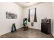 This exercise room features weightlifting equipment and a mini-refrigerator at 22495 E Silver Creek Ln, Queen Creek, AZ 85142