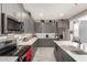 Well-equipped kitchen with gray cabinets, stainless steel appliances, and large counter space at 22495 E Silver Creek Ln, Queen Creek, AZ 85142
