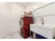 Laundry room featuring new washer and dryer, sink, and storage at 22495 E Silver Creek Ln, Queen Creek, AZ 85142