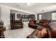 Open-concept living area seamlessly connecting to the kitchen with comfortable seating and modern lighting at 22495 E Silver Creek Ln, Queen Creek, AZ 85142