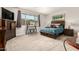 The main bedroom features neutral color scheme, carpet floors, and lots of natural light at 22495 E Silver Creek Ln, Queen Creek, AZ 85142