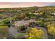 Aerial view of the home and landscaping with pool and mountain views in the background at 22610 N 80Th Pl, Scottsdale, AZ 85255