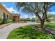 Lush backyard showcasing a well-maintained lawn, desert landscaping, and a covered patio with outdoor amenities at 22610 N 80Th Pl, Scottsdale, AZ 85255