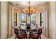 Dining area with round table, chandelier and views of the backyard and pool at 22610 N 80Th Pl, Scottsdale, AZ 85255