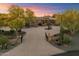 Grand estate featuring desert landscaping, a circular driveway, and a gated entrance to a private oasis at 22610 N 80Th Pl, Scottsdale, AZ 85255