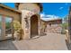 Covered front entry and stone archway at 22610 N 80Th Pl, Scottsdale, AZ 85255