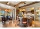 Gourmet kitchen with large island, beamed ceilings and dining area at 22610 N 80Th Pl, Scottsdale, AZ 85255