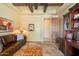 This living area offers a cozy leather sofa, rug, and outdoor access, perfect for relaxation and entertaining at 22610 N 80Th Pl, Scottsdale, AZ 85255