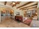 Cozy living room with wooden beams, fireplace, bar area and comfortable seating at 22610 N 80Th Pl, Scottsdale, AZ 85255