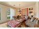 Comfortable living room with a large window, chandelier, and stylish furnishings at 22610 N 80Th Pl, Scottsdale, AZ 85255