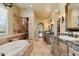 Luxurious main bathroom featuring dual vanities, a soaking tub, and walk-in shower, providing a spa-like experience at 22610 N 80Th Pl, Scottsdale, AZ 85255