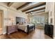 Spacious main bedroom with beamed ceilings, ample natural light, and stylish furnishings, creating a serene retreat at 22610 N 80Th Pl, Scottsdale, AZ 85255
