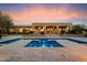 Beautiful pool and outdoor living space with travertine tile and covered patio with ceiling fans at 22610 N 80Th Pl, Scottsdale, AZ 85255